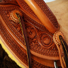 Half Breed Vaquero Wade Saddle by Keith Valley Specs: Wade tree by Rick Reed 15 & 1/2 inch seat, Gullet - 7 & 1/2H X 6 & 1/4W X 4, 93 Degree Bars, Horn - 3 & 5/8ths high X 4 & 1/2 Guatelajara, Cantle - 4&1/2 inches high X 12&1/2 inches wide, Cheyenne Roll - 1 & 3/4 inches, 7/8ths flat plate riggin. Sporting Keith's Vaquero Border with Sheridan Floral tooling within, Stainless Steel Hardware - by Harwood, 4 inch Monel Stirrups, Santa Barbara twisted for easy handling, Vaquero outside stirrup leathers, 100% handmade Mohair Roper Cinch, Hand cut 7 foot latigos for both sides. Made for a special order - **SOLD** but we take orders.